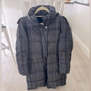 Women’s Burberry coat with classic plaid pattern knee length.